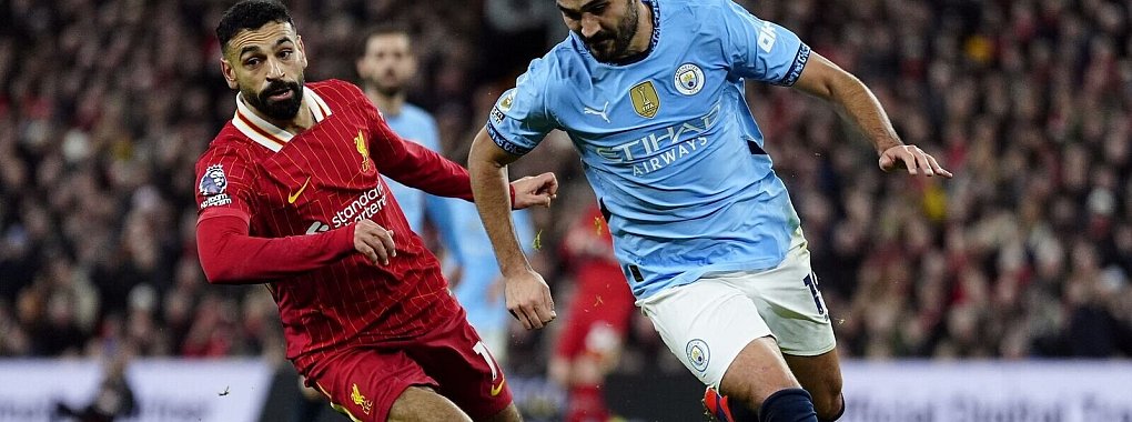 Liverpools Torschütze Mohamed Salah im Duell mit Man Citys Ilkay Gündogan - © Peter Byrne/PA Wire/dpa