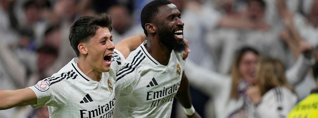 Antonio Rüdiger (r) war der Matchwinner für Real Madrid. - © Bernat Armangue/AP/dpa