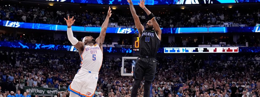 Oklahomas Luguentz Dort (5) kann den Wurf von Mavericks-Guard Kyrie Irving nicht verhindern. - &copy; Tony Gutierrez/AP