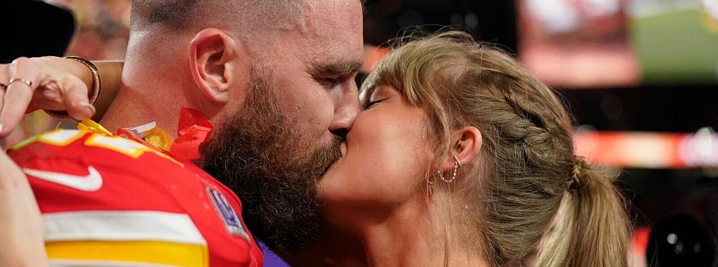 Taylor Swift k&uuml;sst Kansas City Chiefs Tight End Travis Kelce. - &copy; Brynn Anderson/AP/dpa