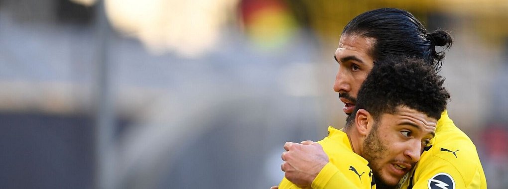 Emre Can (r) w&uuml;nscht sich eine R&uuml;ckkehr von Jadon Sancho zum BVB. - &copy; Marius Becker/dpa