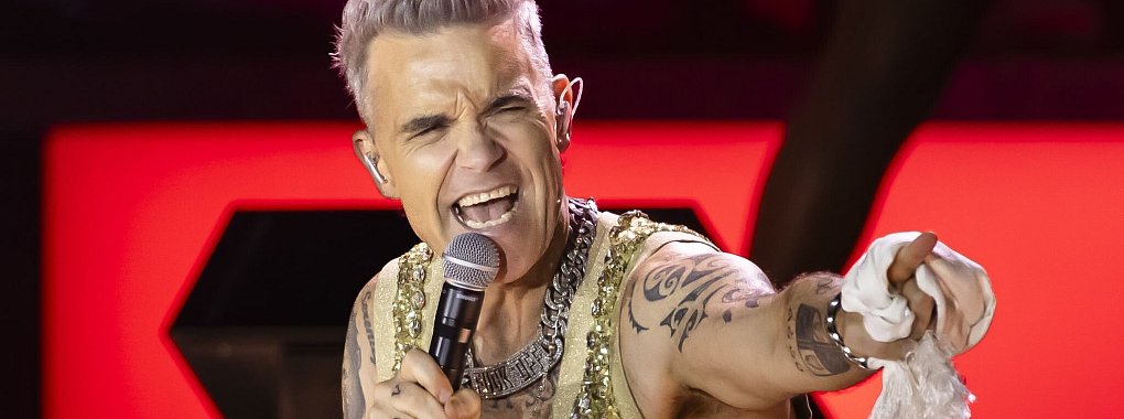 Auch Popstar Robbie Williams kommt nach Deutschland. (Archivbild) - © Michael Buholzer/Keystone/dpa