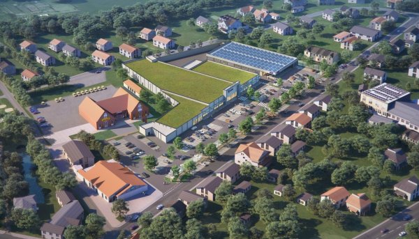 So soll das Fachmarktzentrum aussehen. Im Vordergrund diagonal durchs Bild verläuft die Kampstraße mit dem Tedi unten links und der ehemaligen Post (jetzt Torten-Konditorei) darüber. Links liegt die Altstadt. Im Hintergrund ist die Wiesenstraße zu sehen.  - © halsdorfer + ingenieure projekt gmbh