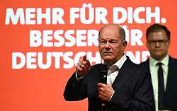 Kanzler Scholz bemängelt Versäumnisse bei der Asylrechts-Umsetzung in Bayern. - © Martin Schutt/dpa