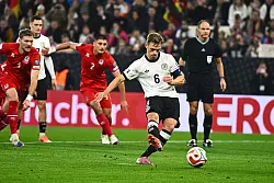 Joshua Kimmich als souveräner Elfmeterschütze im Stil von Harry Kane. - © Tom Weller/dpa