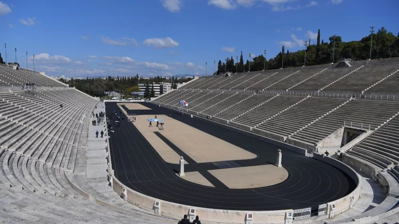 Keine große Zeremonie in Athen: Unwetter durchkreuzen die Pläne für die Übergabe des olympischen Feuers. - © Aris Messinis/AFP POOL/AP/dpa