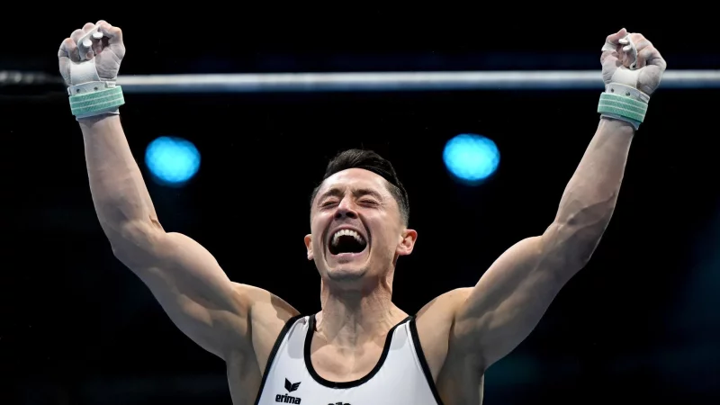 Andreas Toba bejubelt seine famose Reckübung und den Finaleinzug. - © Marijan Murat/dpa