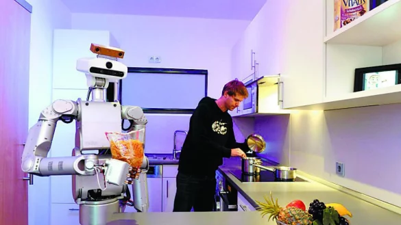 Forschungs-Appartement in Citec: Ein Service-Roboter hilft Bewohnern beim Kochen in der K&uuml;che. - &copy; Citec